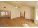 Expansive living room with hardwood floors, modern lighting, and seamless flow into the dining area at 4284 Caroline Ct, Douglasville, GA 30135