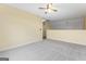 Open bedroom featuring neutral walls, plush carpet, and a view of a hallway at 167 London Dr, Mcdonough, GA 30253