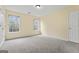 Bright bedroom with ample natural light and neutral carpet, perfect for relaxation at 167 London Dr, Mcdonough, GA 30253