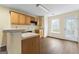 Functional kitchen with wood cabinets, a window, and a convenient door to the outside at 167 London Dr, Mcdonough, GA 30253