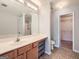 Bathroom features a large mirror, modern vanity with a sink, and a walk-in shower at 1963 Lakeshore Overlook Nw Cir, Kennesaw, GA 30152