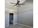 Primary bedroom with ceiling fan and access to bathroom at 175 Camry Ln, Grayson, GA 30017