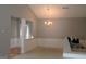 Bright dining room with chandelier and wainscoting at 175 Camry Ln, Grayson, GA 30017