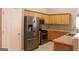 Modern kitchen with stainless steel appliances and light oak cabinets at 175 Camry Ln, Grayson, GA 30017