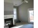 Living room with fireplace and French doors to patio at 175 Camry Ln, Grayson, GA 30017