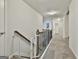 Upstairs hallway with carpeted floors and a baby gate at 22 Marvin Gardens, Sharpsburg, GA 30277