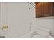 Well-maintained bathroom with a tub/shower combination, white fixtures, and functional storage at 85 Bloomfield Way, Sharpsburg, GA 30277