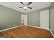 Spacious bedroom with wood floors, neutral walls, ceiling fan, and abundant natural light, offering a serene atmosphere at 85 Bloomfield Way, Sharpsburg, GA 30277