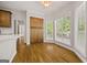 Breakfast nook with hardwood floors, large windows, and built-in cabinets, offering ample natural light at 85 Bloomfield Way, Sharpsburg, GA 30277