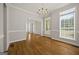 This is a view of the foyer with stylish lighting and hardwood floors at 85 Bloomfield Way, Sharpsburg, GA 30277