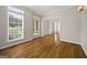Sun-filled foyer with hardwood floors, large windows, and an open entryway creates a welcoming ambiance at 85 Bloomfield Way, Sharpsburg, GA 30277