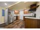 Kitchen featuring stainless steel appliances and hardwood floors at 85 Bloomfield Way, Sharpsburg, GA 30277