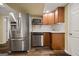 Kitchen featuring stainless steel appliances and hardwood floors at 85 Bloomfield Way, Sharpsburg, GA 30277