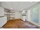 Spacious storage room with white cabinetry, shelves, and access to the exterior at 85 Bloomfield Way, Sharpsburg, GA 30277