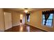 Simple bedroom with hardwood floors and two windows, offering natural light at 621 Granby Hill Pl, Alpharetta, GA 30022