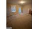 Spacious carpeted bedroom with door and window at 2809 Hillside Way, Decatur, GA 30034