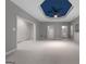 Large common area with blue ceiling, carpet, and multiple doors at 340 Antebellum Way, Fayetteville, GA 30215