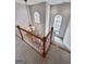 Elegant staircase with wooden railings and chandelier at 340 Antebellum Way, Fayetteville, GA 30215