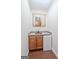 Basement wet bar with sink, mini-fridge, and wood cabinets at 340 Antebellum Way, Fayetteville, GA 30215