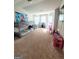 Spacious bedroom with bunk beds, play area, and plenty of natural light at 116 Jodi Pl, Locust Grove, GA 30248