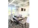 Elegant dining room with decorative ceiling and walls, modern chandelier, and seating for six at 116 Jodi Pl, Locust Grove, GA 30248