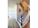 Bright hallway featuring hardwood floors, staircase, and classic white trim at 116 Jodi Pl, Locust Grove, GA 30248