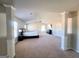 Expansive main bedroom features sitting area, neutral tones, and a ceiling fan at 116 Jodi Pl, Locust Grove, GA 30248