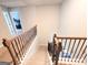 Staircase with iron railings and views to the second floor at 116 Jodi Pl, Locust Grove, GA 30248
