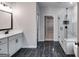 Modern bathroom featuring black marble floors, glass shower, and access to the walk-in closet at 426 Ayers Rd, Bowdon, GA 30108