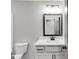 Bathroom with neutral walls and a toilet and sink at 426 Ayers Rd, Bowdon, GA 30108