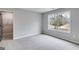 Bedroom with neutral walls, carpet flooring, a window and walk-in closet at 426 Ayers Rd, Bowdon, GA 30108