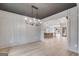Dining room featuring light grey walls, modern light fixture, and open concept living at 426 Ayers Rd, Bowdon, GA 30108