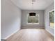 Empty dining room featuring hardwood floors, neutral paint, and a modern chandelier at 426 Ayers Rd, Bowdon, GA 30108