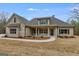 Charming single Gathering home featuring stone accents, neutral color palette, and inviting covered front porch at 426 Ayers Rd, Bowdon, GA 30108