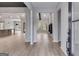 Open-concept foyer featuring wood-look flooring, view to the living room and natural light at 426 Ayers Rd, Bowdon, GA 30108