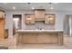 Bright kitchen with wooden cabinets, gray backsplash, large island, and pendant lighting at 426 Ayers Rd, Bowdon, GA 30108