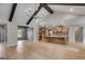 Open concept living area showcasing vaulted ceilings, wooden beams, and open floor plan at 426 Ayers Rd, Bowdon, GA 30108