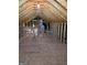 Unfinished attic space featuring exposed wood framing, plywood flooring, and visible mechanical components at 1601 Celestial Ct, Mcdonough, GA 30253