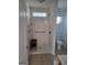 Accessible walk-in shower with grab bars and bench plus adjacent toilet area at 1601 Celestial Ct, Mcdonough, GA 30253