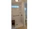 Accessible bathroom with a walk-in shower, safety bars, and tiled walls at 1601 Celestial Ct, Mcdonough, GA 30253