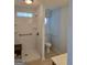 Bathroom featuring a walk-in shower with handrails, and a separate toilet at 1601 Celestial Ct, Mcdonough, GA 30253