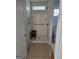 Accessible walk-in shower featuring grab bars, bench, and tiled floor at 1601 Celestial Ct, Mcdonough, GA 30253