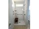 Bathroom features a bench, shelves, and handicap bars at 1601 Celestial Ct, Mcdonough, GA 30253