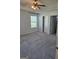 Bright bedroom features a ceiling fan, a window, and two closets at 1601 Celestial Ct, Mcdonough, GA 30253