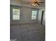 Bedroom features a ceiling fan and two windows at 1601 Celestial Ct, Mcdonough, GA 30253