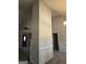 Open living space with neutral walls, gray carpet, and a view of the foyer at 1601 Celestial Ct, Mcdonough, GA 30253