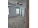 Spacious primary bedroom featuring tray ceiling, neutral carpet, and plenty of natural light at 1601 Celestial Ct, Mcdonough, GA 30253