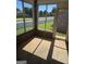 Enclosed sunroom with brick accents and scenic views of the front yard at 1601 Celestial Ct, Mcdonough, GA 30253