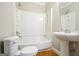 Bathroom features a tub/shower combo, toilet, and pedestal sink at 849 Wagon Wheel Cir, Fayetteville, GA 30214