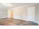 Bedroom featuring modern flooring, neutral walls, and ample natural light from the windows at 849 Wagon Wheel Cir, Fayetteville, GA 30214